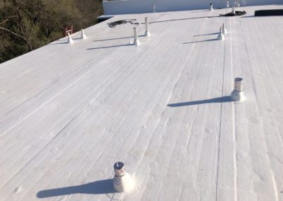 White commercial roofing installed by P-G Roofing and Construction